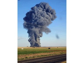 In this photo provided by Castro County Emergency Management, smoke fills the sky after an explosion and fire at the Southfork Dairy Farms near Dimmitt, Texas, on Monday, April 10, 2023. The explosion at the dairy farm in the Texas Panhandle that critically injured one person and killed an estimated 18,000 head of cattle is the deadliest barn fire recorded since the Animal Welfare Institute began tracking the fires. (Castro County Emergency Management via AP)