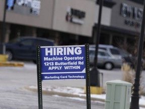 File - A hiring sign is seen in Downers Grove, Ill., Thursday, May 5, 2022. On Tuesday, the Labor Department reports on job openings and labor turnover for February.