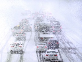 Traffic is stopped due to snowy weather conditions on Route 93 South, Tuesday, March 14, 2023, in Londonderry, N.H.