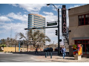 A person crosses the street on Wednesday, March 1, 2023 in Midland, TX. A Facebook page called "Maybe In Midland-Odessa" takes public input is given on how to improve the entertainment and cultural aspects of the cities.