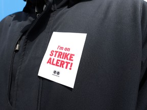 Some of the 155,000 membership of the Public Service Alliance of Canada (PSAC) hold a picket line outside Canada Centre in Toronto. Experts say PSAC's strike could have far-reaching effects beyond its own members.