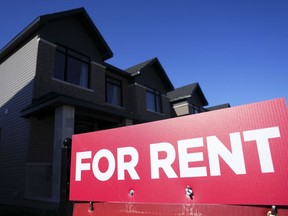 A for rent sign is displayed on a house in Ottawa on Friday, Oct. 14, 2022. Rentals.ca and Urbanation's latest rent report says average rents across Canada were up one per cent between February and March – the first monthly increase since November.