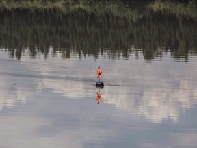 A scarecrow floats in a Suncor oilsands tailings pond in Fort McMurray.