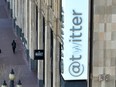 In an aerial view, a modified company sign is posted on the exterior of the Twitter headquarters on April 10, 2023 in San Francisco.