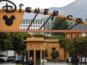 Signage is displayed at the entrance to The Walt Disney Co. Studios in Burbank, Calif.