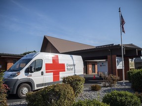 FILE - An American Red Cross Disaster Relief van sits outside the Camas Church of the Nazarene, Oct. 17, 2022, in Camas, Wash. The church was functioning as a disaster relief shelter from the nearby Nakia Creek Fire. The first comprehensive poll to measure public attitudes on foundations and nonprofits offers signs that charitable organizations are more trusted than other institutions. But it shows many warning signs for nonprofits, given how little Americans know about charities and the pessimism they have about the ability of charities to make a positive difference in the world.