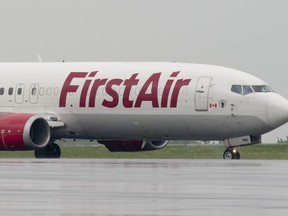 A First Air plane is shown on the runway before takeoff Wednesday June 26, 2019, in Ottawa. The Canadian government announced late last month it had approved new terms and conditions for Canadian North's merger with First Air.