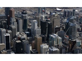 CALGARY, CANADA - FEBRUARY 26: An aerial view of the Scotiabank Saddledome in the background and the Calgary Tower and the rest of the city skyline as seen from above on February 26, 2016 in Calgary, Alberta.