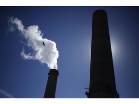 Water vapor rises from the NRG Energy Inc. WA Parish generating station in Thompsons, Texas, U.S., on Thursday, Feb. 16, 2017. The plant is home to the Petra Nova Carbon Capture Project, a joint venture between NRG Energy and JX Nippon Oil & Gas Exploration Corp., which reportedly captures and repurposes more than 90% of its own Co2 emissions. Photographer: Luke Sharrett/Bloomberg