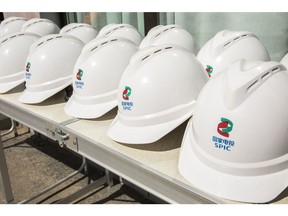 The State Power Investment Corp. logo on safety hats at the Golmud Solar Park near Golmud, China.