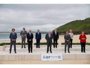 Trudeau, Michel, Biden, then-Japanese Prime Minister Yoshihide Suga, Johnson, Draghi, Macron, von der Leyen and then-Germany Chancellor Angela Merkel at the family photo for the G-7 summit in the UK in June 2021.