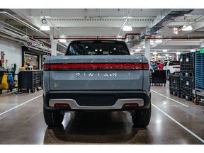 A Rivian R1T electric vehicle (EV) pickup truck at the company's manufacturing facility in Normal, Illinois, US., on Monday, April 11, 2022. Rivian Automotive Inc. produced 2,553 vehicles in the first quarter as the maker of plug-in trucks contended with a snarled supply chain and pandemic challenges.