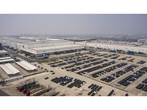Vehicles in a lot at the Tesla Inc. Gigafactory in Shanghai, China, on Wednesday, June 15, 2022. Tesla has staged a remarkable comeback in terms of its production in China, with May output more than tripling despite the electric carmaker only recently getting its Shanghai factory back up to speed after the city's punishing lockdowns.
