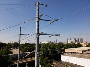 Utility poles during a heat advisory in Atlanta, Georgia, US, on Wednesday, June 22, 2022. Temperatures in Atlanta on Wednesday flirted with a record-high and triple digits, just a week after the city smashed a 70-year-old daily temperature record when it hit 99 degrees, reports The Atlanta Journal-Constitution.