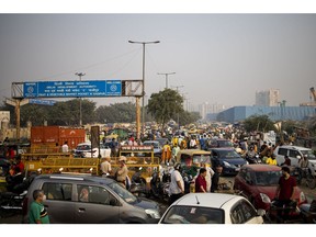 A traffic snarl during the festival of Diwali at a wholesale flower market on the outskirts of New Delhi, India on Monday, Oct. 24, 2022. This year's Diwali, the festival of lights that falls on Oct. 24 and the equivalent of Christmas in the West, will be India's first season of celebration since the pandemic began without virus-related restrictions.