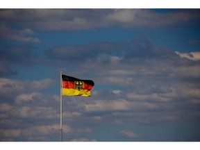 A German national flag in Salzgitter, Germany, on Tuesday, July 5, 2022. Salzgitter AG is looking to transform billowing foundries dating back decades into green steel production in a project to remain viable for years to come and a key test of German industry's ability to transition to cleaner technologies. Photographer: Krisztian Bocsi/Bloomberg