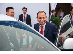 Pham Nhat Vuong, chairman of Vingroup JSC, attends the loading ceremony of VinFast LLC's VF8 electric vehicles at a port in Haiphong, Vietnam, on Friday, Nov. 25, 2022. VinFast, which said in July that it had signed agreements with banks to raise at least $4 billion to help its US expansion, has about 73,000 global reservations for its EVs, according to the company. It has secured about $1.2 billion in incentives for its planned EV factory in North Carolina, where it intends to start production in 2024, according to the auto manufacturer.