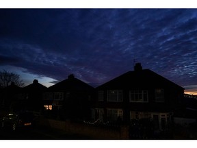 A single light on at residential houses during a period of peak energy demand in Brotton, UK.