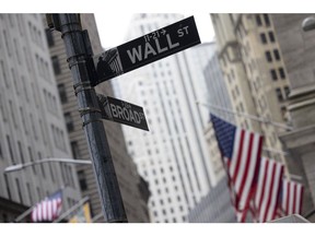 A "Wall Street" sign near the New York Stock Exchange (NYSE) in New York, US on Thursday, March 23, 2023. Stocks struggled for direction as banks remained lower even after Treasury Secretary Janet Yellen said in prepared remarks to lawmakers that the US is ready to take further measures to protect deposits, if needed. Photographer: Angus Mordant/Bloomberg