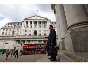 Pedestrians pass the Bank of England (BOE) in the City of London, UK, on Thursday, May 11, 2023. The Bank of England raised its benchmark lending rate to the highest level since 2008, saying further increases may be needed if inflationary pressures persist.