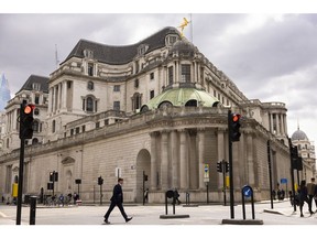 A pedestrian passes the Bank of England in the City of London, UK, on Monday, May 15, 2023. The upcoming batch of jobs data, due on Tuesday, May 16, is likely to show price pressures in the economy remain way too high for the Bank of England to tolerate.