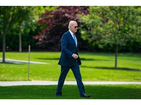 US President Joe Biden walks on the South Lawn of the White House before boarding Marine One in Washington, DC, US, on Wednesday, May 17, 2023. Biden is scrapping planned stops in Australia and Papua New Guinea following his trip to Japan for the Group of Seven meeting to return for continuing negotiations with Republicans over raising the debt ceiling.