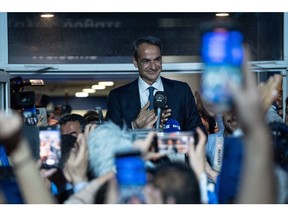 Kyriakos Mitsotakis, Greece's prime minister and leader of New Democracy party, speaks to supporters outside the party's headquarters following Greece's general election, in Athens, Greece, on Sunday, May 21, 2023. Mitsotakis is poised to win the most votes in Greece's general election on Sunday, but he'll likely fall short of the threshold to form a government on his own, raising the prospect of another election in about a month.