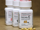 Bottles of the prescription painkiller OxyContin, made by Purdue Pharma, sit on a counter at a local pharmacy in Provo, Utah.