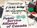 PSAC strikers' picket signs demanding fare wages on Friday, April 28, in Victoria, B.C.
