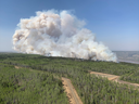 A wildfire burns a section of forest in the Grande Prairie district of Alberta on May 6.