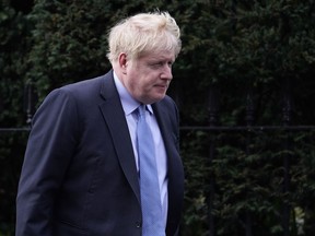 FILE - Boris Johnson leaves his house in London, on March 22, 2023. Boris Johnson established an independent inquiry while he was U.K. prime minister into the government's handling of the COVID-19 pandemic. Now the inquiry wants to see what Johnson wrote to other U.K. officials as the outbreak raged. But the government is fighting a demand to hand over the material.