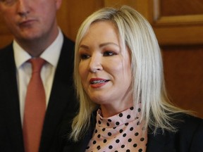 FILE - Sinn Fein deputy leader Michelle O'Neill speaks to the media at Parliament Buildings, Stormont, Belfast, on May 9, 2022. Irish nationalist party Sinn Fein is set to take the most seats in Northern Ireland's local elections and repeat its success from last year's assembly elections, when it became the region's largest party for the first time. With about 400 of 462 local government seats counted Saturday, Sinn Fein, which seeks unification of Northern Ireland with the Republic of Ireland, took 128 seats and made breakthroughs in some areas.
