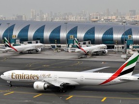 FILE - An Emirates plane taxis to a gate at Dubai International Airport at Dubai International Airport in Dubai, United Arab Emirates, on Wednesday, March 22, 2017. Long-haul carrier Emirates said Thursday, May 11, 2023, it saw its most-profitable year ever in 2022, earning $2.9 billion after bouncing back from the coronavirus pandemic shutting down global aviation.