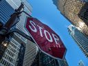Bank towers and a stop sign in Toronto's financial district.