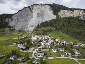 View of the village and the "Brienzer Rutsch", taken on Tuesday, 9 May 2023, in Brienz-Brinzauls, Switzerland. Authorities in eastern Switzerland have ordered residents of the tiny village of Brienz to evacuate by Friday evening because geology experts say a mass of 2 million cubic meters of Alpine rock looming overhead could break loose and spill down in coming weeks.