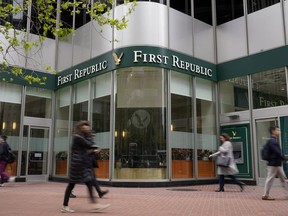 Pedestrians walk past the headquarters of First Republic Bank in San Francisco, Monday, May 1, 2023. Regulators seized the troubled bank early Monday, making it the second-largest bank failure in U.S. history, and promptly sold all of its deposits and most of its assets to JPMorgan Chase Bank in a bid to head off further banking turmoil in the U.S.