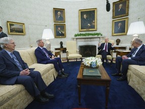 Senate Minority Leader Mitch McConnell of Ky., Speaker of the House Kevin McCarthy of Calif., and Senate Majority Leader Sen. Chuck Schumer of N.Y., listen as President Joe Biden speaks before a meeting to discuss the debt limit in the Oval Office of the White House, Tuesday, May 9, 2023, in Washington.