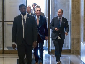 Speaker of the House Kevin McCarthy, R-Calif., returns after he spoke privately to his Republican colleagues, at the Capitol in Washington, Tuesday, May 23, 2023.