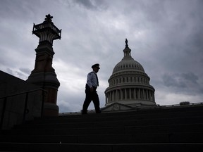 A police officer walks along the East Front of the U.S. Capitol, in Washington, D.C.