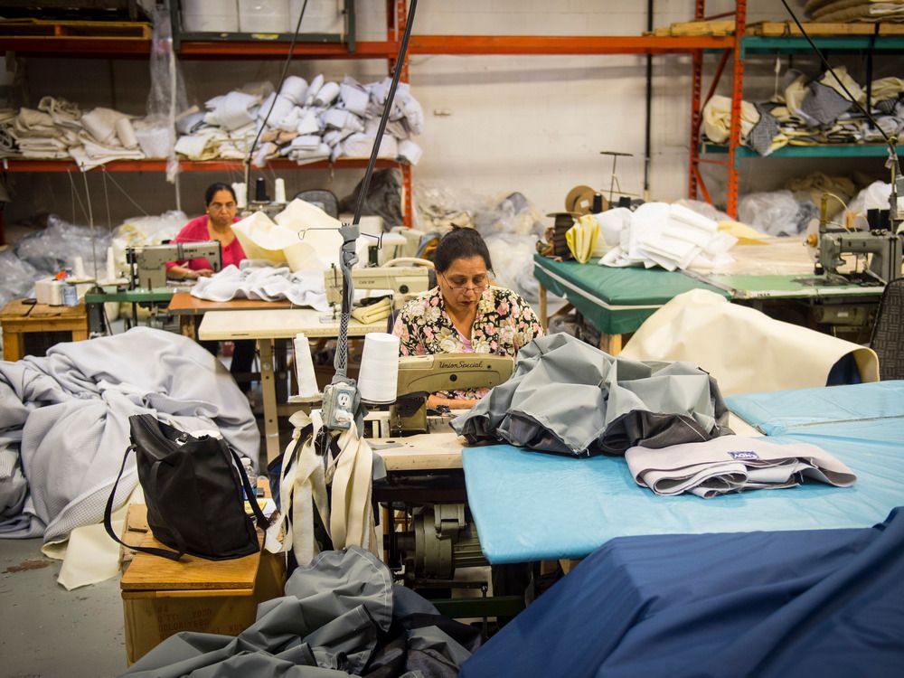  women work on sewing machines at a factory where endy makes mattresses in toronto, in 2015.