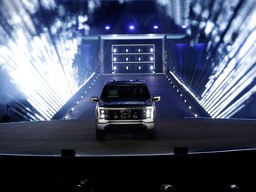 Ford's new electric F-150 Lightning outside of its headquarters.