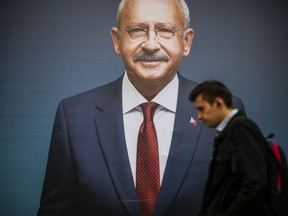 A man walks past a billboard of Turkish CHP party leader and Nation Alliance's presidential candidate Kemal Kilicdaroglu a day after the presidential election day, in Istanbul, Turkey, Monday, May 15, 2023. Turkey's presidential elections appeared to be heading toward a second-round runoff on Monday, with President Recep Tayyip Erdogan, who has ruled his country with a firm grip for 20 years, leading over his chief challenger, but falling short of the votes needed for an outright win.