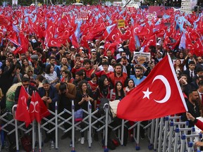 Supporters of Turkish CHP party leader and Nation Alliance's presidential candidate Kemal Kilicdaroglu wave Turkish flags during an election campaign rally in Ankara, Turkey, Friday, May 12, 2023. Turkey is heading toward presidential and parliamentary elections on Sunday.