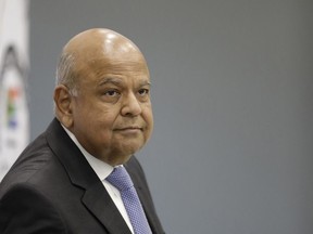 FILE -- Public Enterprises Minister Pravin Gordhan appears at the judicial commission of inquiry into state capture in Johannesburg, South Africa. Monday, Nov. 19, 2018. Gordhan has denied corruption allegations against the ruling African National Congress party related to the country's embattled power utility Eskom amid a devasting electricity crisis faced by the country.