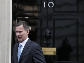 FILE - Britain's Chancellor of the Exchequer Jeremy Hunt leaves 10 Downing Street in London, Jan. 18, 2023. Britain's Treasury chief said he would be prepared to see the U.K. economy slip back into recession if further interest rate hikes are necessary to bring down inflation.