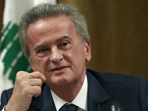 FILE - Riad Salameh, Lebanon's Central Bank governor, smiles during a press conference in Beirut, on Nov. 11, 2019. Salameh did not appear before French prosecutors for questioning in Paris, Tuesday May 16, 2023 in an ongoing European probe into alleged money-laundering and illicit enrichment.