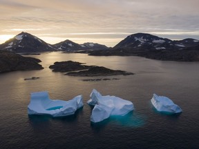 FILE - Large Icebergs float away as the sun rises near Kulusuk, Greenland, Aug. 16, 2019. Norway has taken over the Arctic Council's rotating presidency from Russia on Thursday, May 11, 2023 amid concerns that the work of the eight-country intergovernmental body on protecting the sensitive environment is at risk due to suspension of cooperation with Moscow over the Ukraine war. Research involving Russia ranging from climate work to mapping polar bears have been put on hold and scientists have lost access to important facilities in the Russian Arctic.