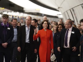 Britain's Prince William and Kate, Princess of Wales travel on London Underground's Elizabeth Line in central London, Thursday, May 4, 2023 on their way to visit the Dog & Duck pub in Soho to hear how it's preparing for the coronation of King Charles III and the Queen Consort.