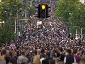 People march during a protest against violence in Belgrade, Serbia, Friday, May 19, 2023. Tens of thousands of people rallied in Serbia's capital on Friday for a third time in a month in protest at the government's handling of a crisis after two mass shootings in the Balkan country earlier this month, even as officials rejected the criticism and ignored their demands.
