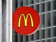 FILE - A McDonald's sign at a restaurant in downtown Pittsburgh, April 24, 2017. Federal investigators found more than 300 minors, including  10-year-olds, were working illegally.